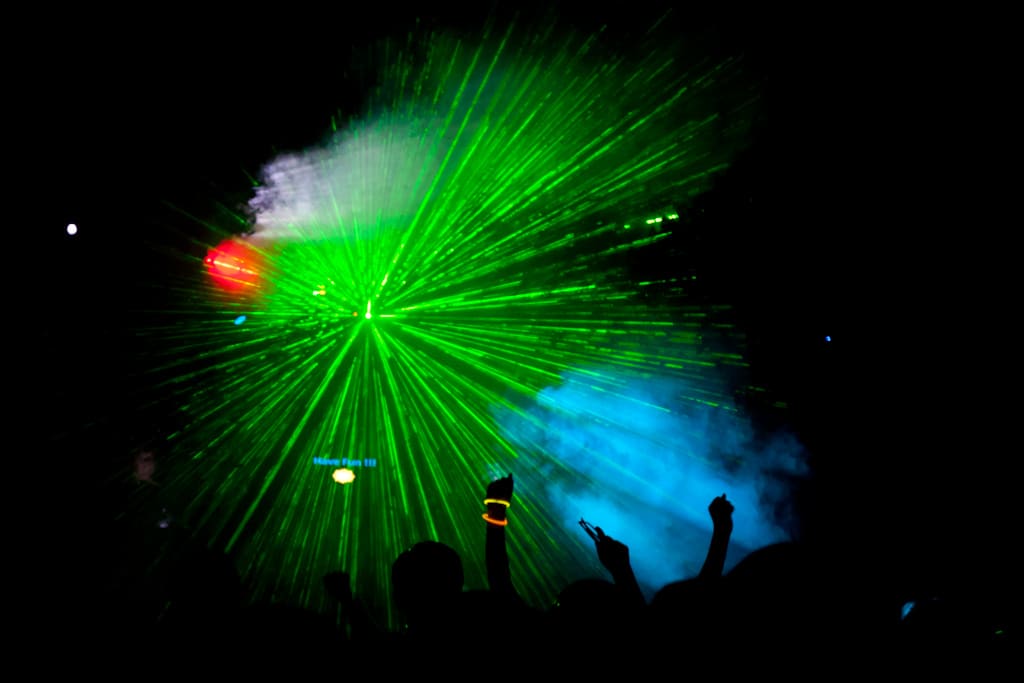 Dance lasers at a Calgary event with a DJ