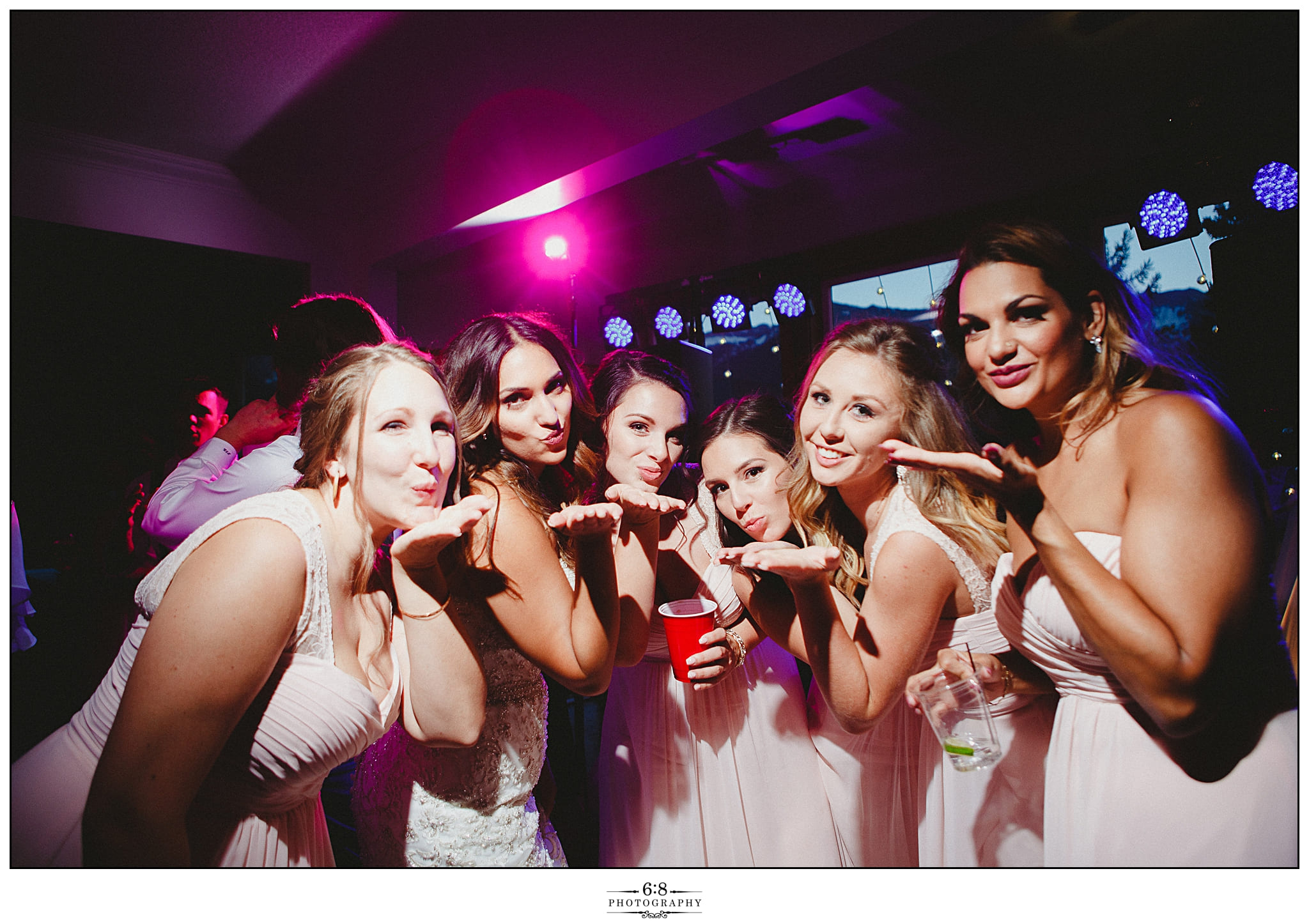 Brides and bridesmaids on the dancefloor at a wedding with a Calgary DJ